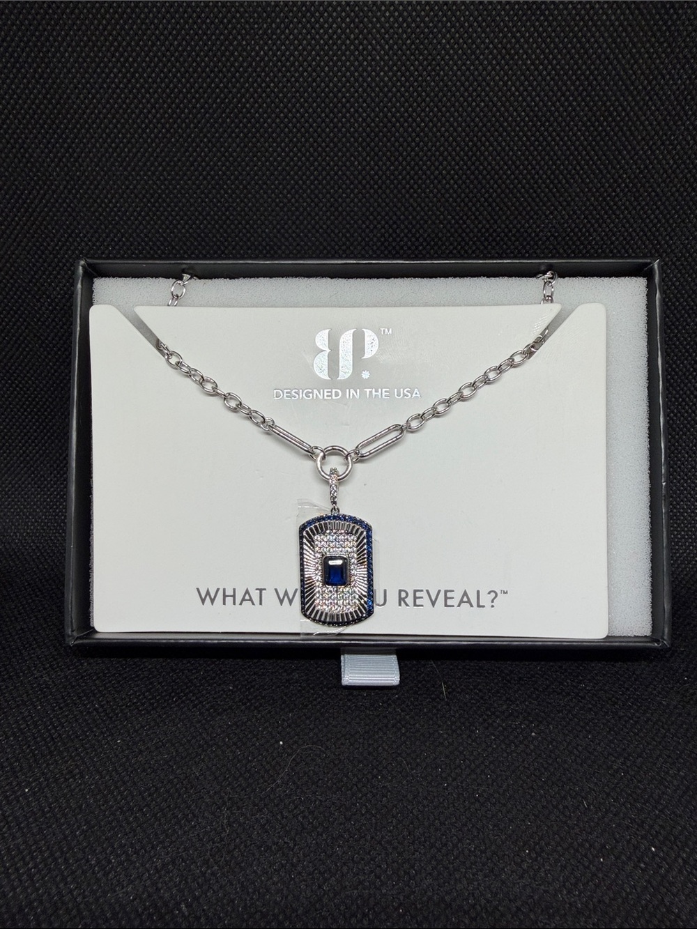 September 26: Sapphire on Rhodium Dog Tag